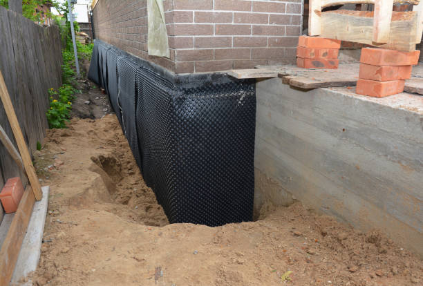 SJ Waterproofing Pros technician performing targeted Exterior Waterproofing assessment in Ludington, MI
